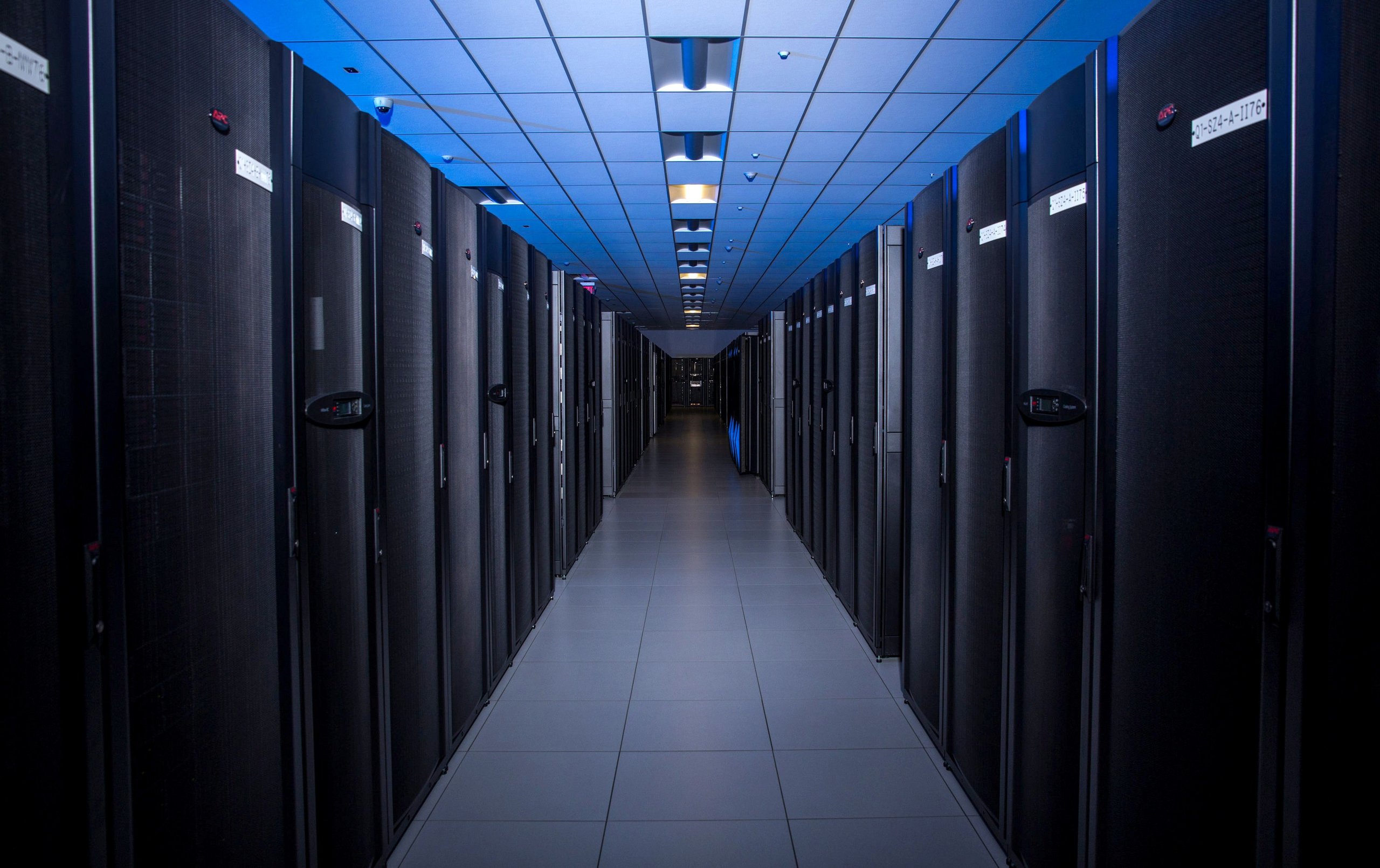 Data center aisle with server racks